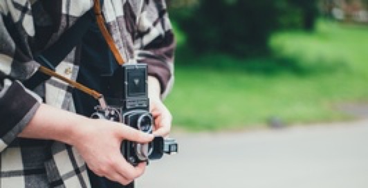 student with camera