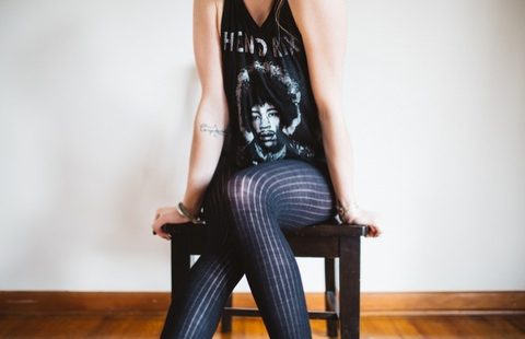 model in tights and Jimi Hendrix shirt